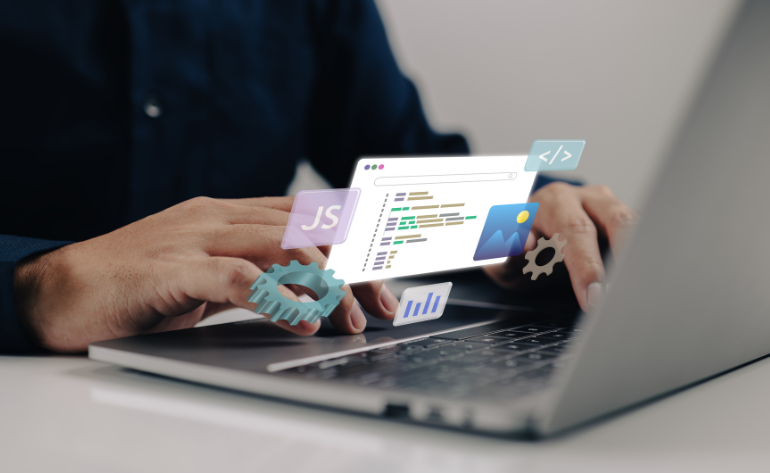 Hand typing on a laptop with real-time pop-up showing JavaScript and file activity during website performance analysis